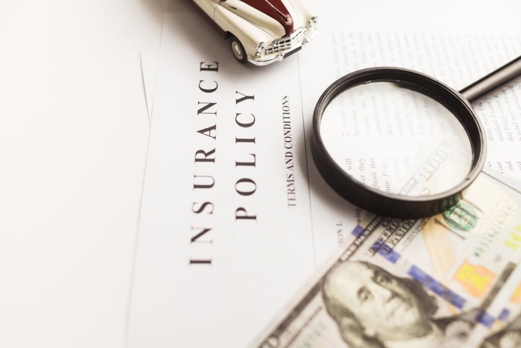 Insurance policy, car, and magnifying glass representing an FR44 quote